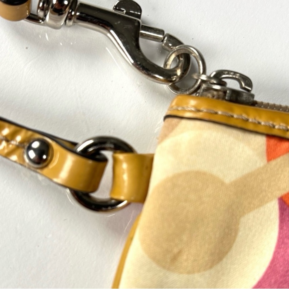 Coach Optic C Colorful Patterned Wristlet
Orange pink cream. Patent Leather - Picture 8 of 11